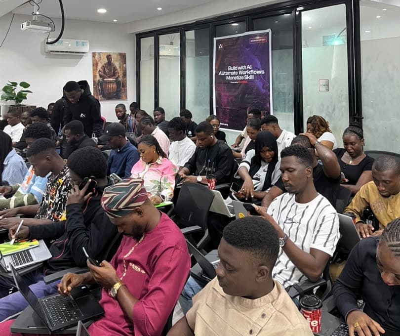 Attendees at Antitect's first workshop in Lagos, beneath the event banner reading "Build with AI, Automate Workflows, Monetize Skill."